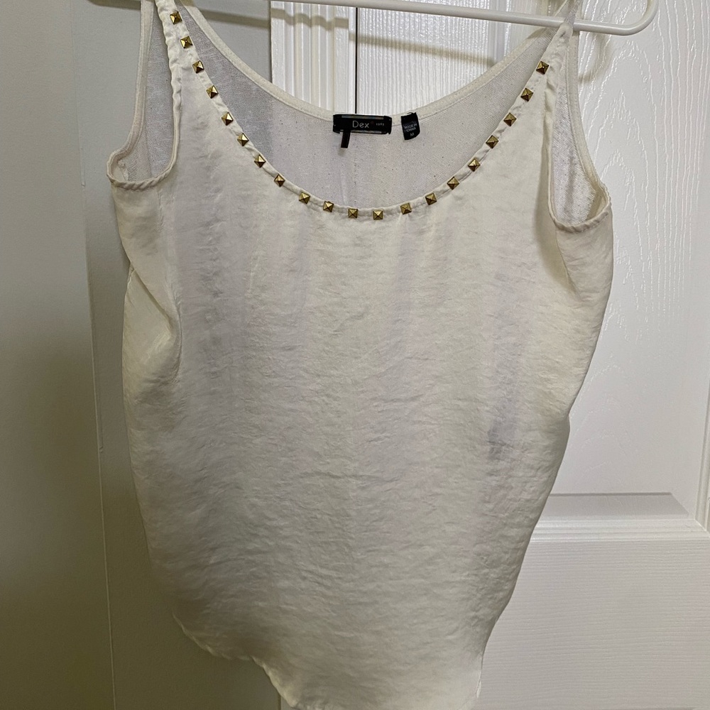 White tank with gold embellishments around neck